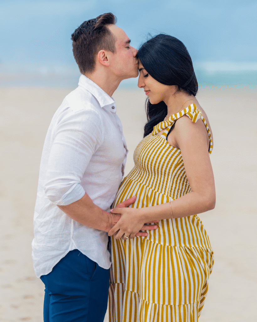 romantic pregnancy photoshoot for couple by the beach in sydney